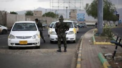 Police stop cars at a checkpoint near the US embassy in Sanaa following an Al Qaeda directive to carry out a terrorist attack.