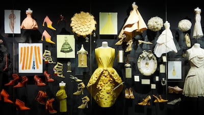 A wall showing colour transitions in the Christian Dior: Designer Of Dreams exhibition. Photo by Adrien Dirand