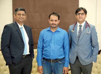 Mian Khan, centre, with Dr Vaibhav Gorde, left, and Dr Rahul Chaudhary. Photo: Burjeel Hospital