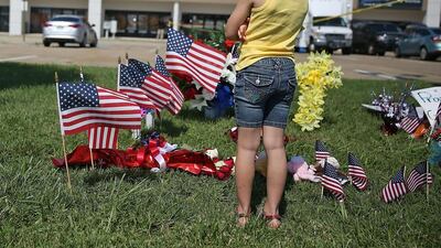 Brooklynn Crawford visits a memorial to those killed in Thursday's Chattanooga shootings. Joe Raedle/Getty Images/AFP