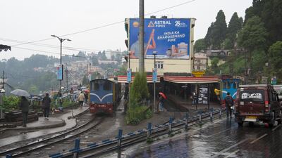Darjeeling Himalayan Railway lines running next to a road