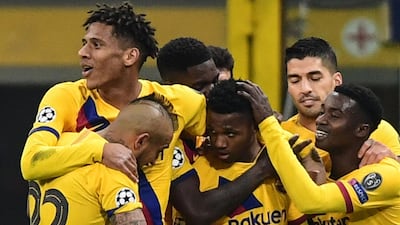 Barcelona forward Ansu Fati (C) celebrates after scoring the winner in Milan. AFP