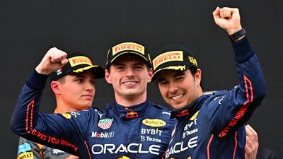 Red Bull's Max Verstappen and Sergio Perez celebrate a one-two on the podium after the Emilia Romagna Grand Prix at the Autodromo Internazionale Enzo e Dino Ferrari race track in Imola, Italy, on April 24. AFP
