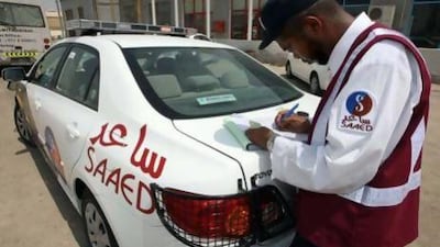 A Saaed patrol officer takes details of an in Mussaffah. Now the private company can be seen on Sharjah’s roads. Stephen Lock / The National