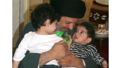 Sayed Jaffar al Allawi, centre, with his children Kadhum, left, and Mahdi seen in Beirut. Mr. al Allawi, from Bahrain, is unable to return home.