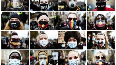 Protesters wear masks during a rally in solidarity with the Black Lives Matter demonstration on June 6, 2020 in Melbourne, Australia. Getty