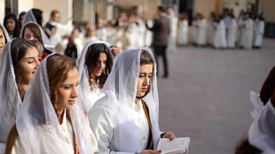 Syriac Christian women pray during a mass celebration of Christmas at the Saint Efram Syriac Orthodox Church in Qamishly, Syria. REUTERS/Rodi Said