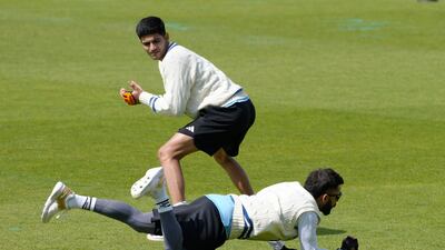 India's Virat Kohli catches a ball during training. AP