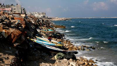 Palestinian fishermen fix their boats and nets on the beach of Gaza City on June 13, 2019. Israel has closed the fishing zone off the coast of Gaza in retaliation for the launching of incendiary balloons. AFP