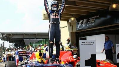 Red Bull's Sebastian Vettel celebrates after winning in Brazil and taking the championship race down to the wire.