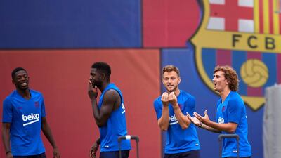 From left: Ousmane Dembele, Samuel Umtiti, Ivan Rakitic and Antoine Griezmann share a joke in training. EPA