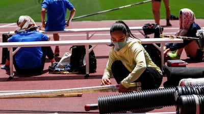 An athlete is seen wearing a face mask as a preventive measure against the coronavirus disease during the morning session of the Athletics test event. Reuters