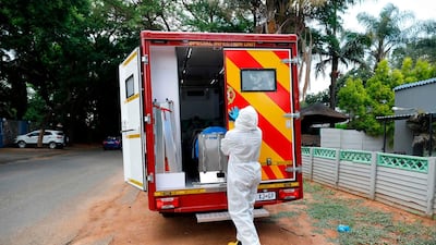 A City of Tshwane's Special Infection Unit paramedic closes the door of an ambulance in the north of Pretoria, South Africa. AFP