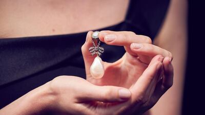 The pearl and diamond pendant belonged to Queen Marie Antoinette, and sold at auction for Dh133 million. Sotheby's