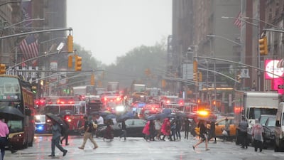 Emergency vehicles fill the street at the scene. Reuters