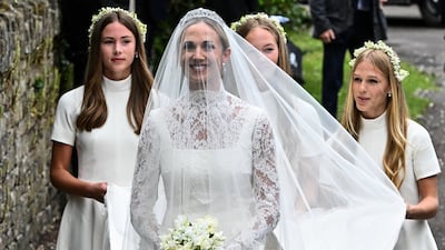Harriet Sperling arrives for her wedding with Princess Anne's son Peter Phillips, accompanied by the bridesmaids, her daughter Georgina and Peter Phillips' daughters Savannah and Isla, at All Saints' Church in Kemble, Gloucestershire. Reuters