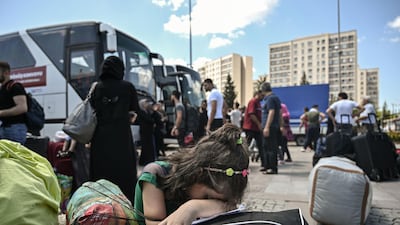 A Syrian girl weeps as other Syrians prepare to board buses in Istanbul to return to neighbouring Syria earlier this month. Turkey has extended its deadline for unregistered migrants to leave the city until October 20. AFP