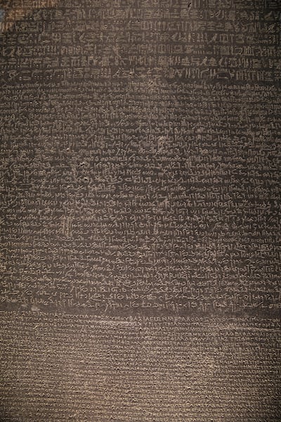 The Rosetta Stone features hieroglyphic, Demotic and Greek inscriptions. Getty Images