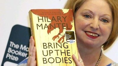 The British author Hilary Mantel with her Booker Prize-winning novel Bring Up the Bodies. Luke MacGregor / Reuters