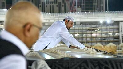Teams clean the Kabaa in Makkah's Grand Mosque. HO