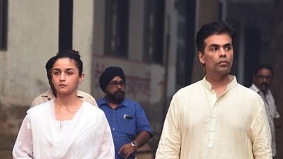 Actress Alia Bhatt and director Karan Johar attend the funeral of Krishna Raj Kapoor. AFP