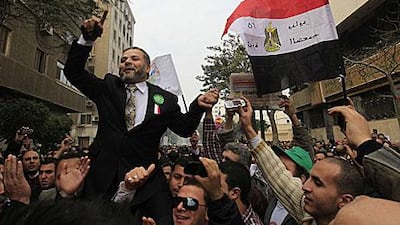 Supporters of Egypt’s Muslim Brotherhood, which has the lion’s share of seats at the new assembly, outside the parliament yesterday.