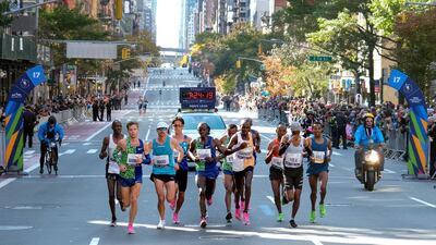 Leaders in the mens' elite race run along First Avenue in Manhattan during the New York Marathon on Sunday, November 3. AP