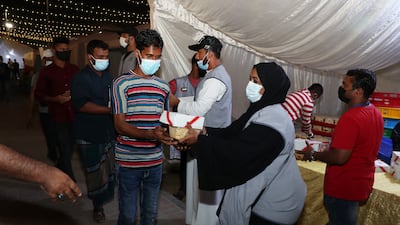 Sharjah Charity International distributes food parcels.
