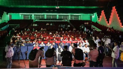 Viewers wait for the first screening of Somali films at The Somali National Theatre in Mogadishu, on September 22, 2021, which has been opened for the first time to public after its inauguration in 2020. (Photo by Abdirahman YUSUF / AFP)