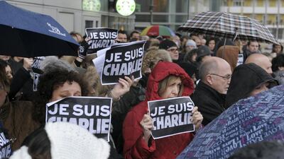 Protesters express their solidarity with the satirical magazine Charlie Hebdo. Photo: Eric Piermont / AFP
