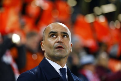 Belgium manager Roberto Martinez was struggling to find answers during their defeat to Switzerland. Reuters