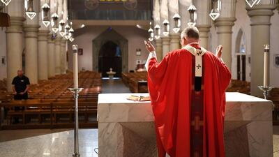 Brisbane's Catholic Archbishop Mark Coleridge delivers a Good Friday mass to an empty St Stephen's cathedral in Brisbane. EPA