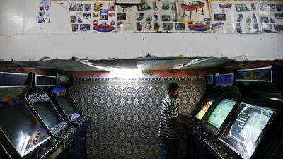 A man plays video games in an entertainment saloon in Rabat’s Medina.