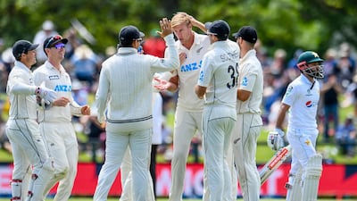 New Zealand bowler Kyle Jamieson, centre, is congratulated by teammates after dismissing Pakistan's Mohammad Rizwan. AP