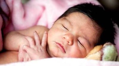 A new baby typically feeds between eight and 12 times every 24 hours, which leaves little time for sleep. iStockphoto