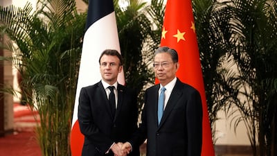 China's National People's Congress chairman Zhao Leji with French President Emmanuel Macron at the Great Hall of the People in Beijing. AFP