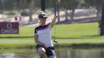 Charley Hull lines up her putt on the ninth hole on Day 1 of the Dubai Ladies Masters at Emirates Golf Club. Jeffrey E Biteng / The National