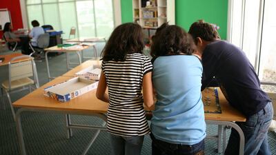 Child abuse victims work on a puzzle at the Dubai Foundation for Women and Children. The foundation dealt with 1,090 domestic abuse cases last year, and helped 124 victims in the second quarter of this year. Nicole Hill / The National