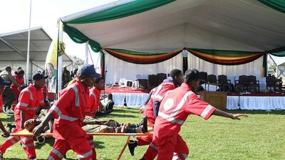 epa06834324 Members of the Zimbabwe Red Cross Society (ZRCS) carry an injured member of the Zimbabwe National Army (ZNA), who was reportedly injured after a suspected bomb went off at a rally addressed by President Emmerson Mnangagwa, at White City Stadium in Bulawayo, Zimbabwe, 23 June 2018. According to media reports, an apparent bomb attack rocked Zimbabwean President Emmerson Mnangagwa's election rally on 23 June in Bulawayo. The incident left multiple people injured, media added. 'The president was evacuated successfully,' his spokesman said. EPA/STRINGER