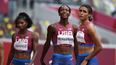 Sydney McLaughlin, right, celebrates her gold medal with silver medalist Dalilah Muhammed in the 400m hurdles at the 2020 Tokyo Olympics.