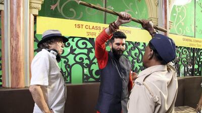 Award-winning Algerian director Karim Traida, left, on the set.
