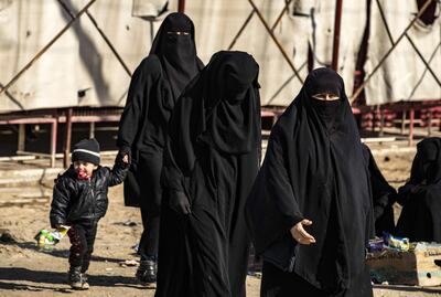 Women walk inside the Kurdish-run Al Hol camp in north-eastern Syria, where families of ISIS foreign fighters are held. AFP