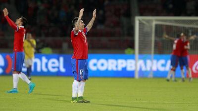 Chile’s Gary Medel acknowledges the crowd on Thurdsay night after the team’s 2018 World Cup qualifying win over Brazil in Santiago. Claudio Reyes / AFP