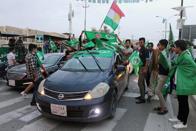 Supporters of the Patriotic Union of Kurdistan celebrate after the closing of ballot boxes during the 2021 parliamentary election. Reuters