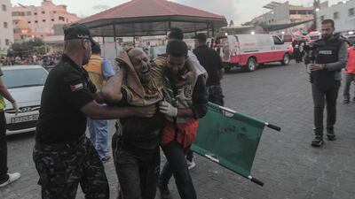 An injured Palestinian man arrives at Al-Shefa hospital in Gaza city. EPA