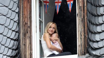 A wellwisher waits for the arrival of Prince William and Catherine ahead of their tour of a traditional German market in the Central Square on day two of their official visit to German. Chris Jackson / Getty Images