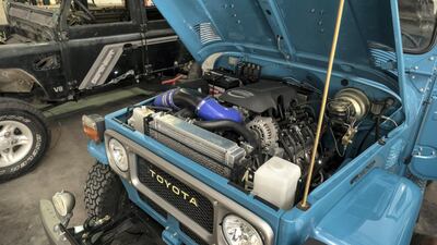 As well as Land Cruisers, Land Rovers are a significant part of the business, such as the Defender, left. Antonie Robertson / The National