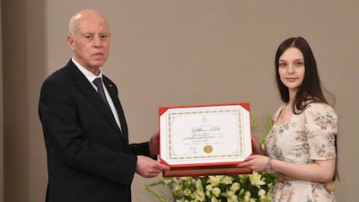 Sally Ben Salem, 22, receiving her award from Tunisian President Kais Saied at Carthage Palace. Photo: Tunisian Presidency