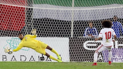 Oman goalkeeper Fayez Al Rusheidi saves Omar Abdulrahman's penalty in regulation time. Abdulrahaman would go on to be denied in the shoot-out as Oman won the Gulf Cup on penalties. Yasser Al Zayyat / AFP