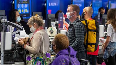 Travellers check in for their flights at LAX in Los Angeles, California. Getty Images